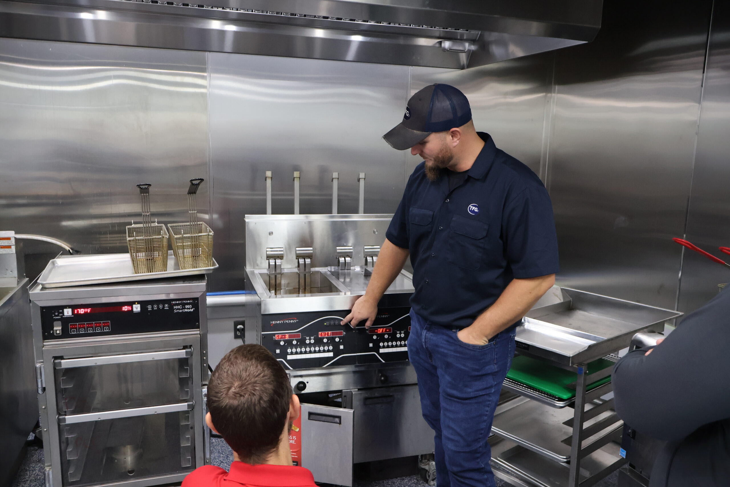 TFG technician providing hands-on commercial kitchen equipment training